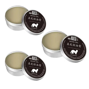 Two tins of mink oil conditioner for leather care, ideal for restoring and protecting leather goods.