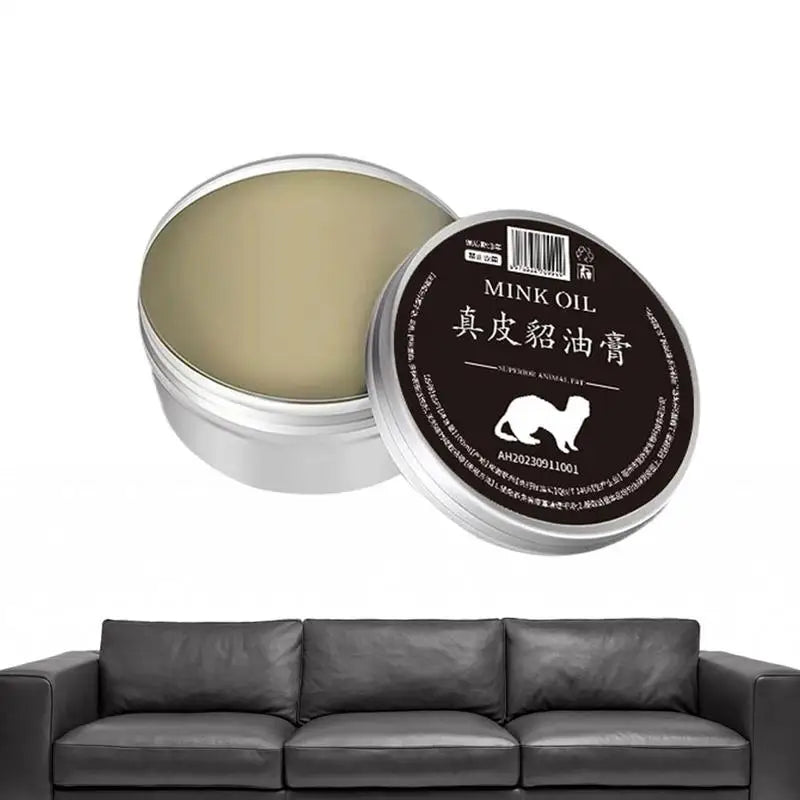Mink oil cream for leather care in a silver tin, ideal for preserving shoes, bags, and upholstery.
