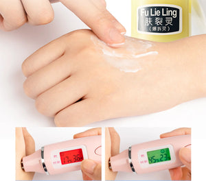 Applying Fu Lie Ling cream on hand with a thermometer showing skin temperature for effective skincare.